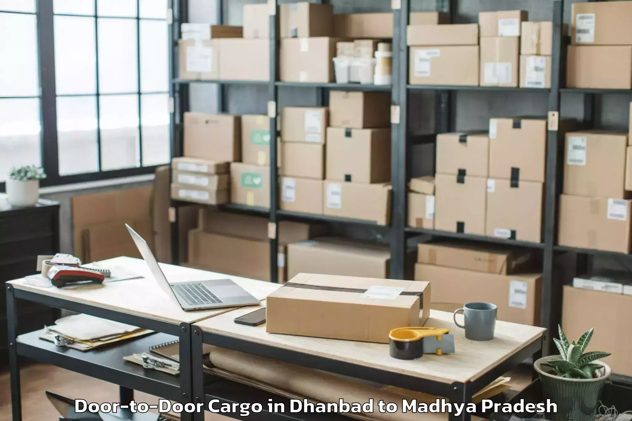 Book Dhanbad to Tarana Door To Door Cargo